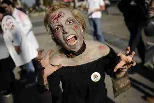 A woman dressed up as a zombie