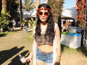 Festival goer with long hair and a floral headband. 