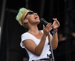 Emeli Sandé on stage, singing into a microphone. 