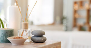 Massage items, including candles, incense, and stones.