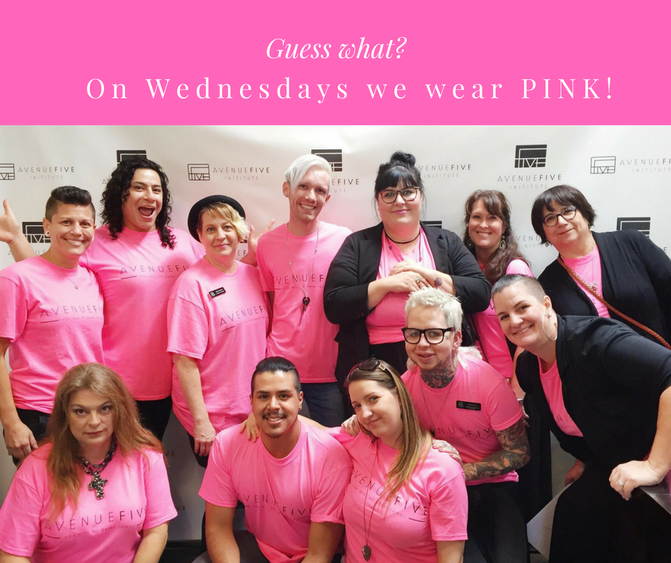 The Avenue Five team all wearing pink shirts and smiling for a group photo.