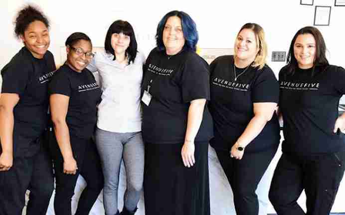 Team photo of the Avenue Five Institute staff, showcasing a group of professional and friendly team members.