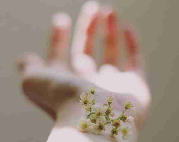 a flower on a wrist