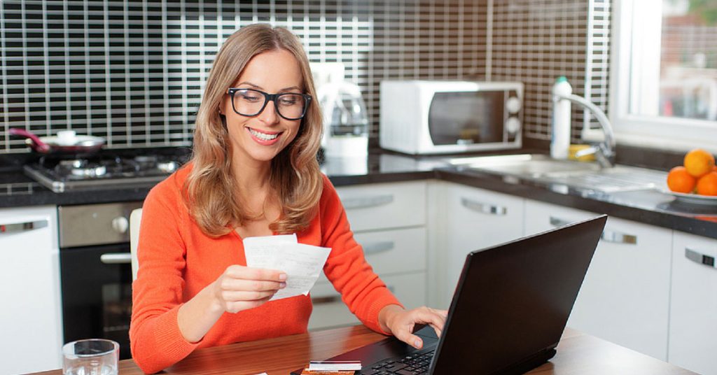 a woman going over her receipts