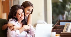 a daughter hugging her mom