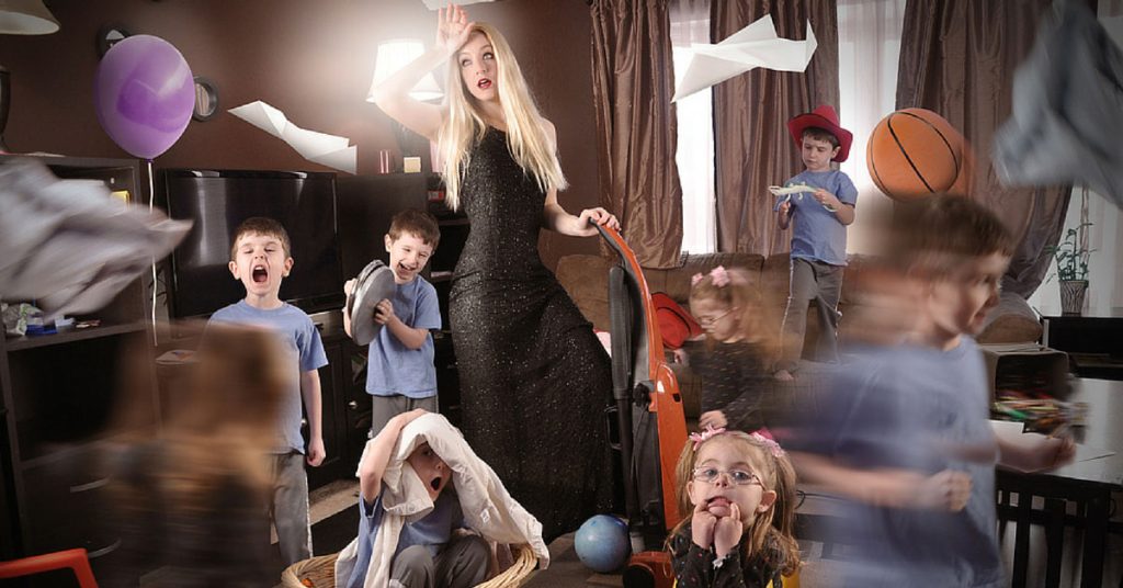 a dressed up mom surrounded by her hyper kids