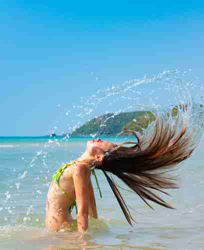 a woman in the ocean posing