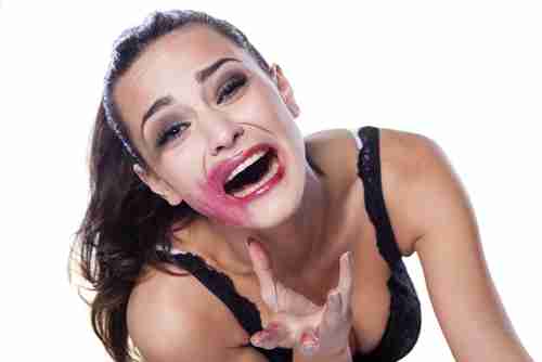 a woman with messed up makeup posing
