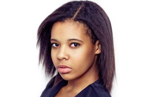 a woman with short hair posing