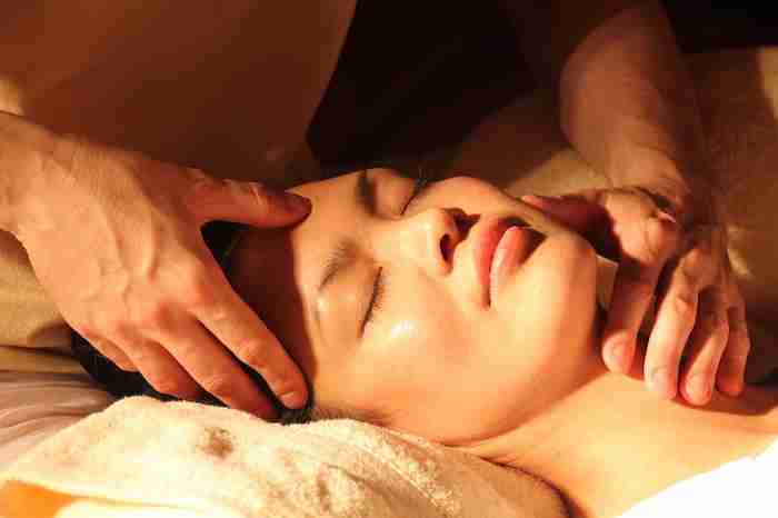a woman getting a facial