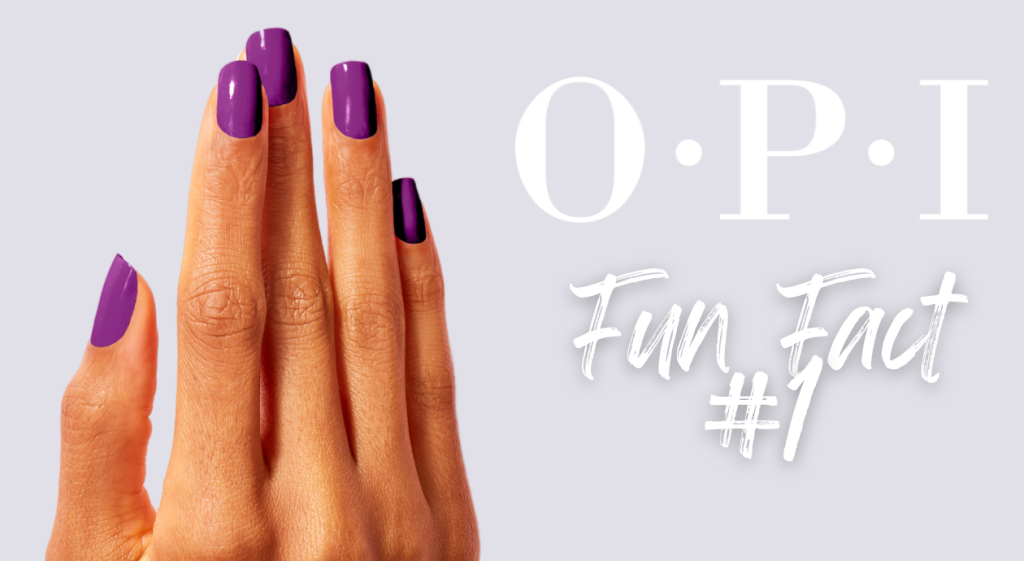 a hand with purple nail polish applied to it.