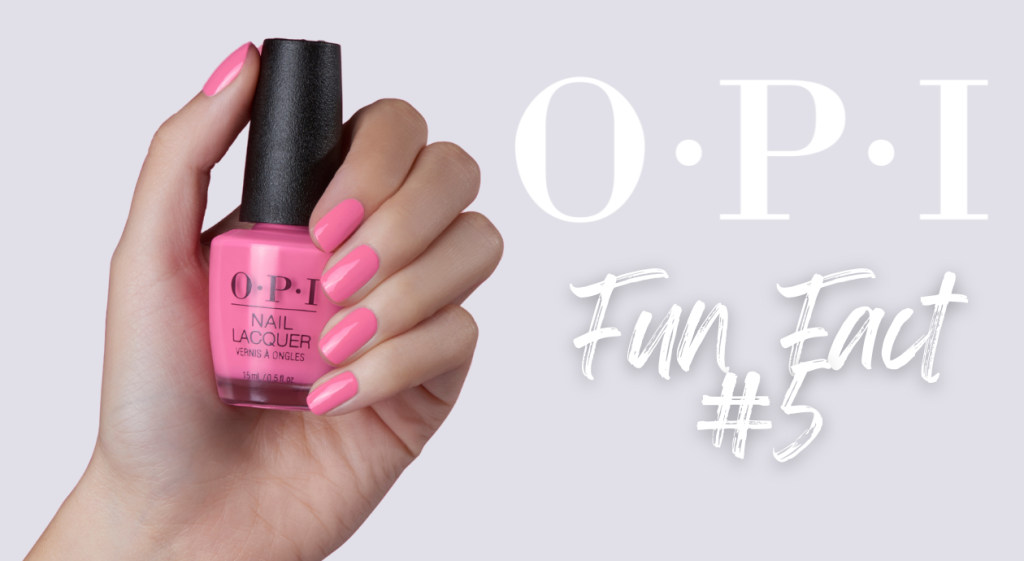 Women holding pink OPI nail polish with it applied on her nails as well.