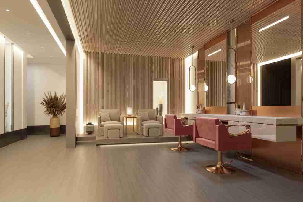 Modern salon interior with styling chairs, backlit mirrors, and a lounge seating area.